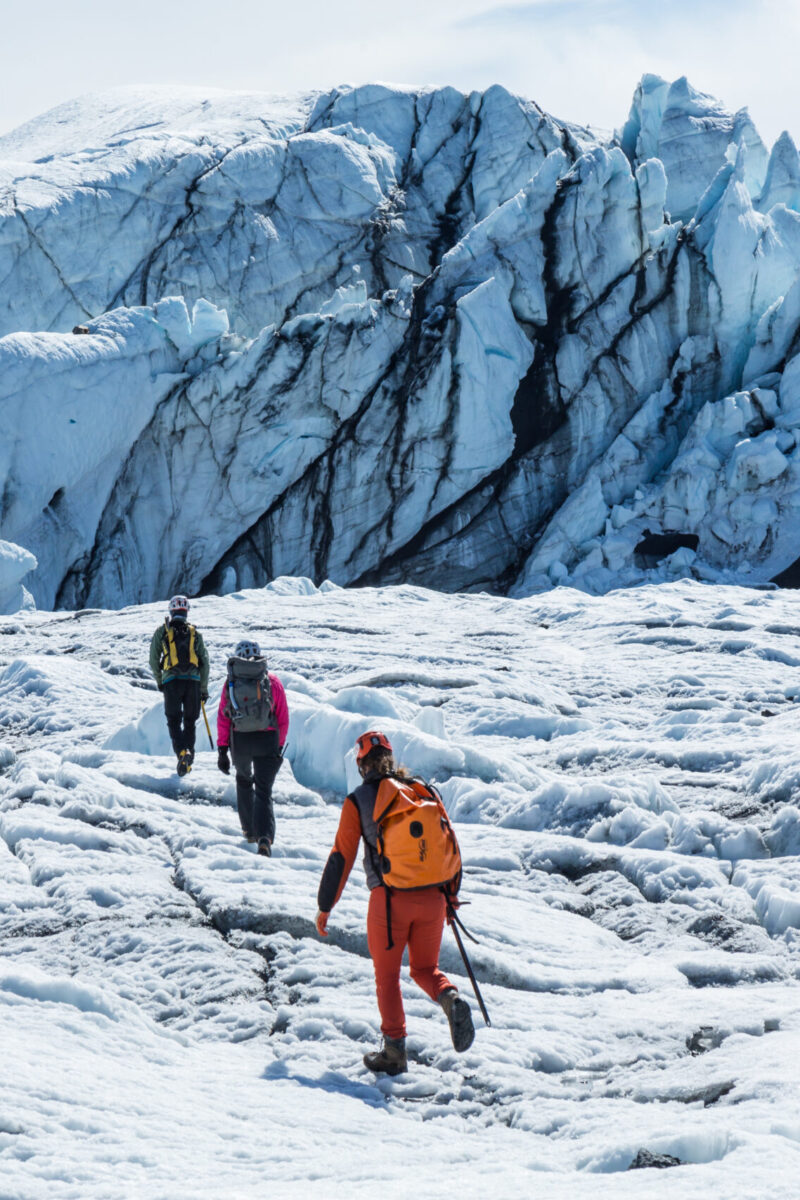 guides in front of icefall